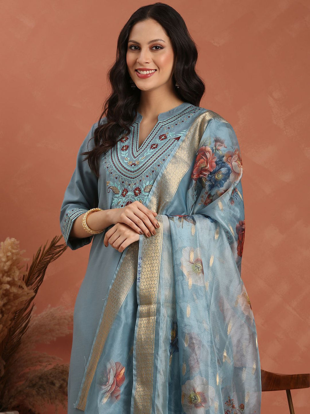 Dhimhi women's floral embroidered kurta set with regular thread work, paired with matching trousers and dupatta.