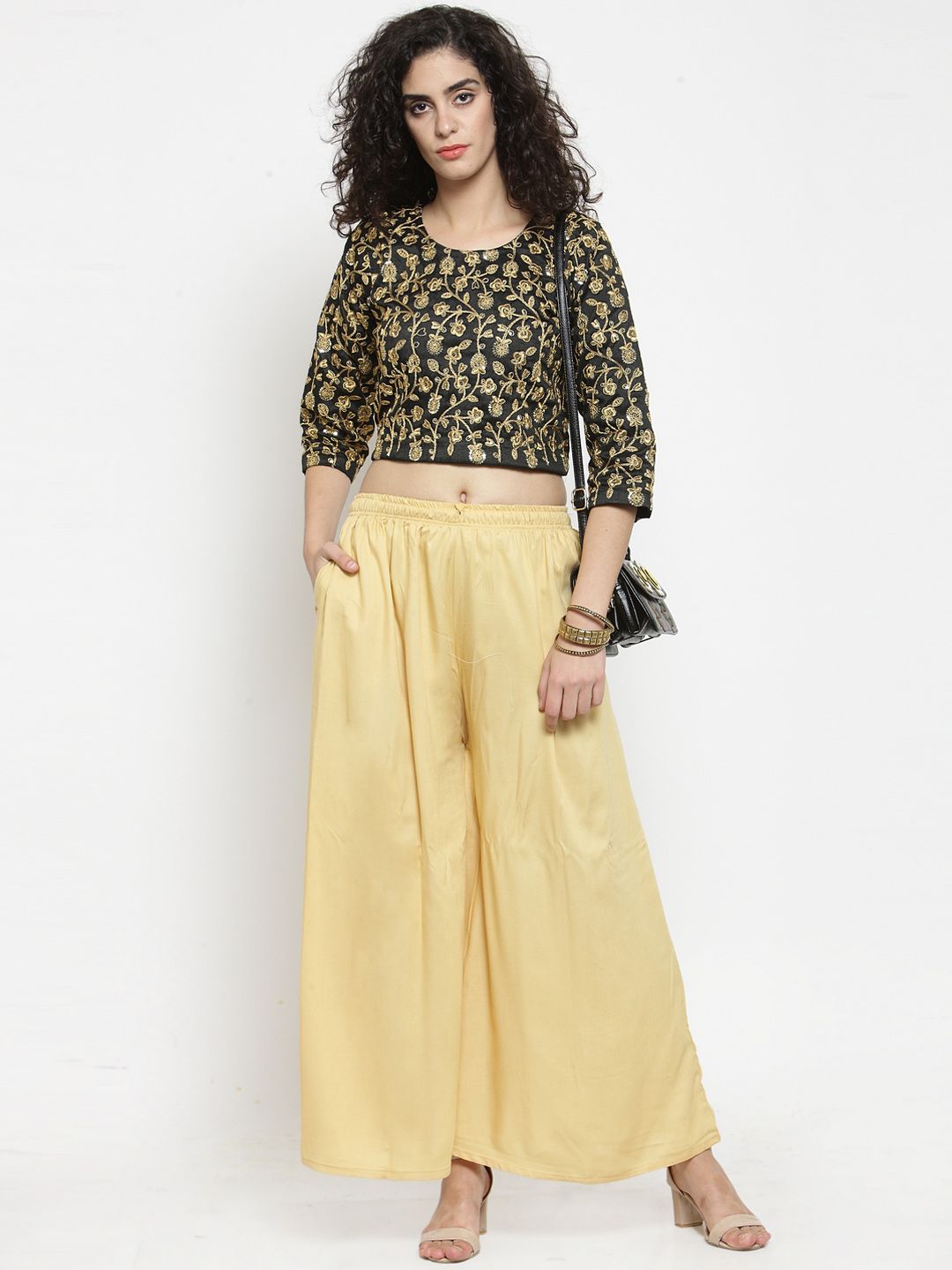 Dhimhi Women's Yellow Solid Flared Palazzos