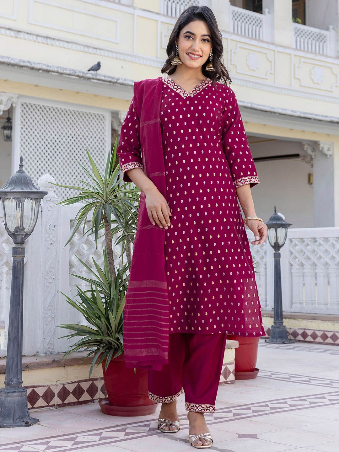 Dhimhi women's paisley embroidered sequined straight kurta set with matching trousers and dupatta, showcasing intricate embroidery and embellishments.