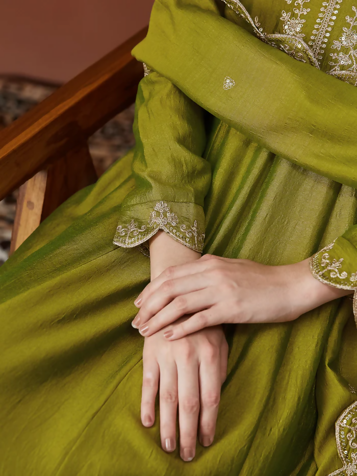 Light green Dhimhi women's Vichitra silk kurta set with embroidered flared Anarkali pants and matching dupatta, elegant traditional attire.