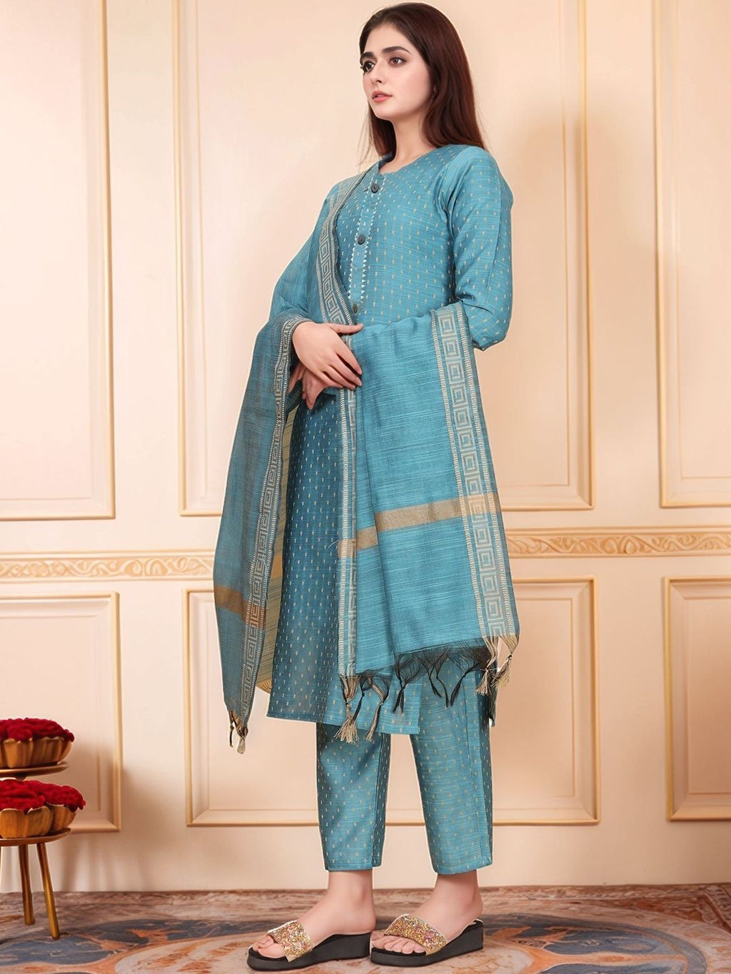 Dhimhi women's regular kurta set with matching trousers and dupatta, featuring traditional embroidery in vibrant colors.