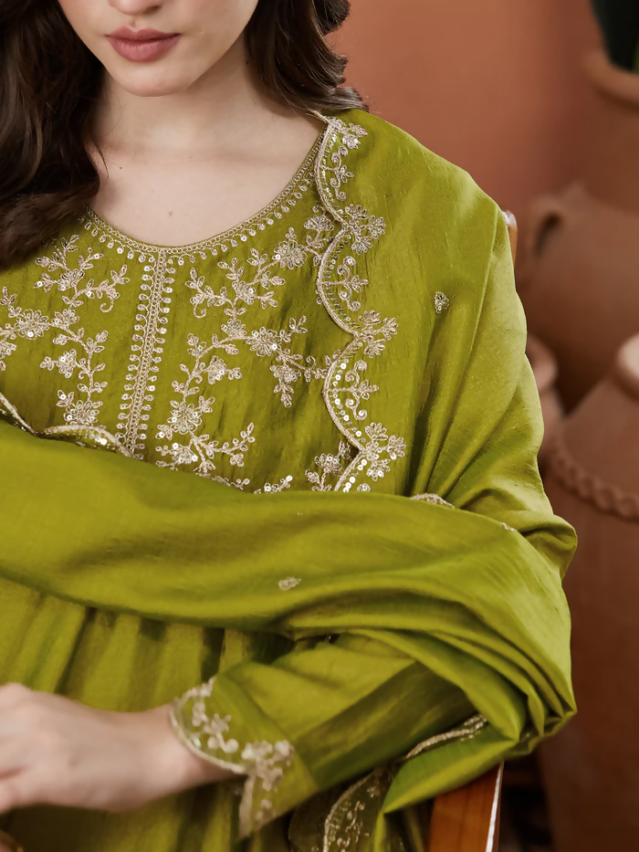 Light green Dhimhi women's Vichitra silk kurta set with embroidered flared Anarkali pants and matching dupatta, elegant traditional attire.