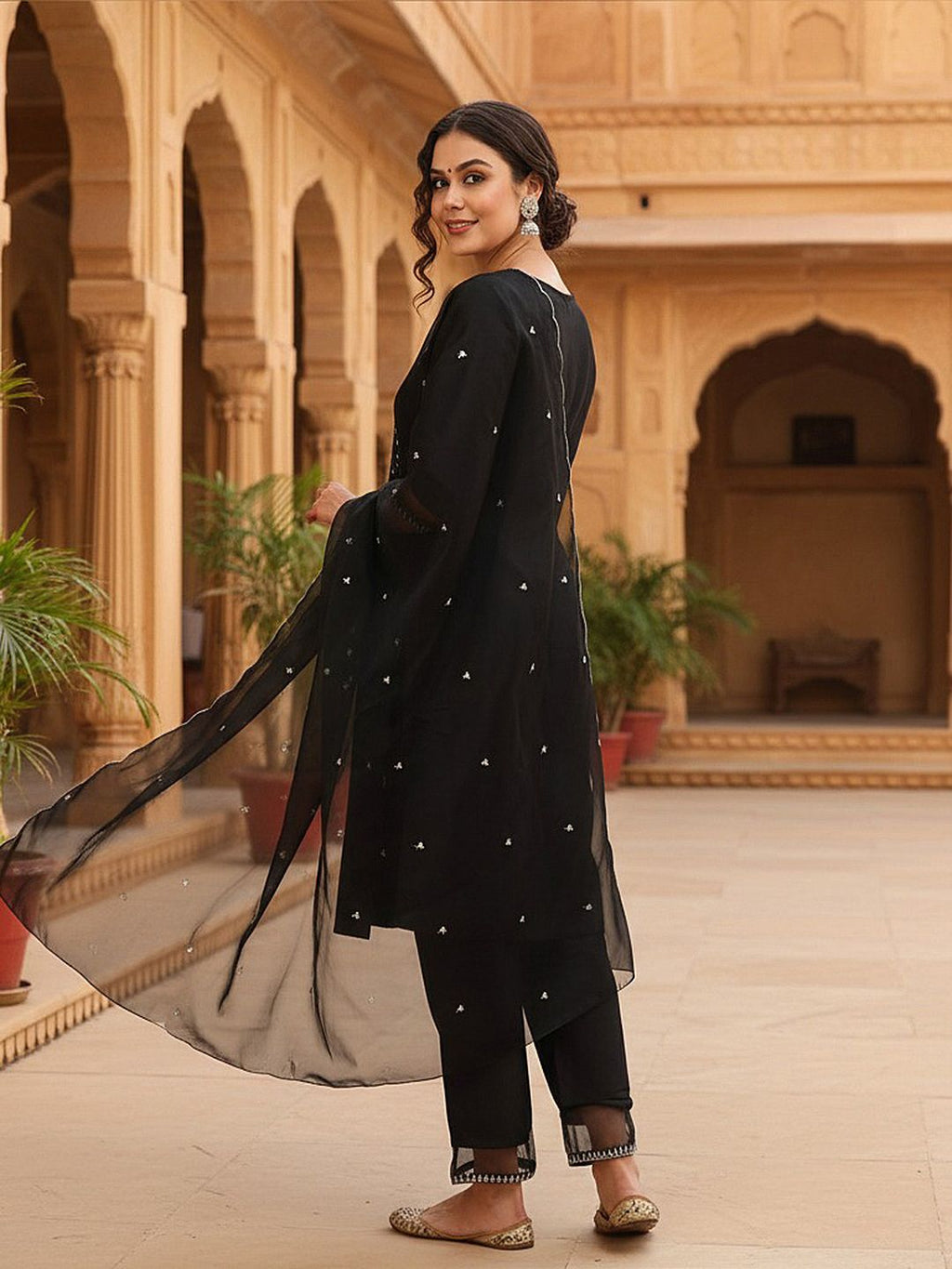 Dhimhi women's ethnic motifs yoke design sequinned kurta set with matching trousers and dupatta, featuring intricate embroidery.