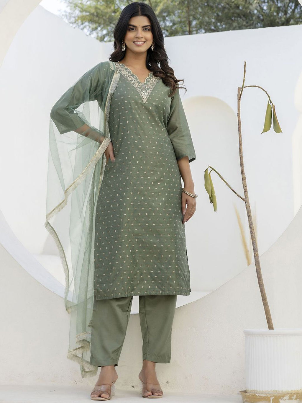 Dhimhi women's ethnic kurta pant set with dupatta, featuring traditional design and vibrant fabric, displayed on a model.