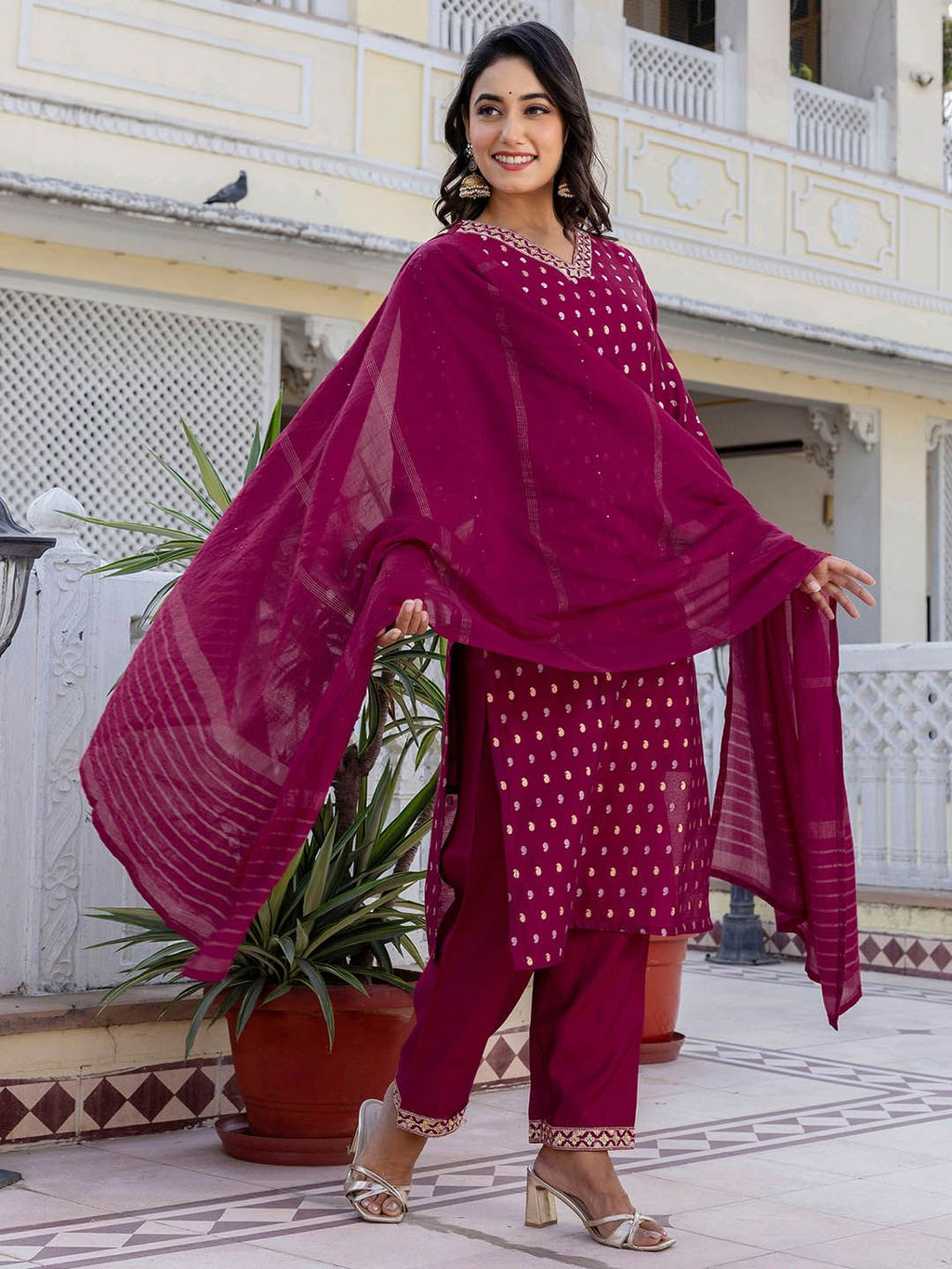 Dhimhi women's paisley embroidered sequinned straight kurta set with matching trousers and dupatta, featuring intricate embroidery and embellishments.