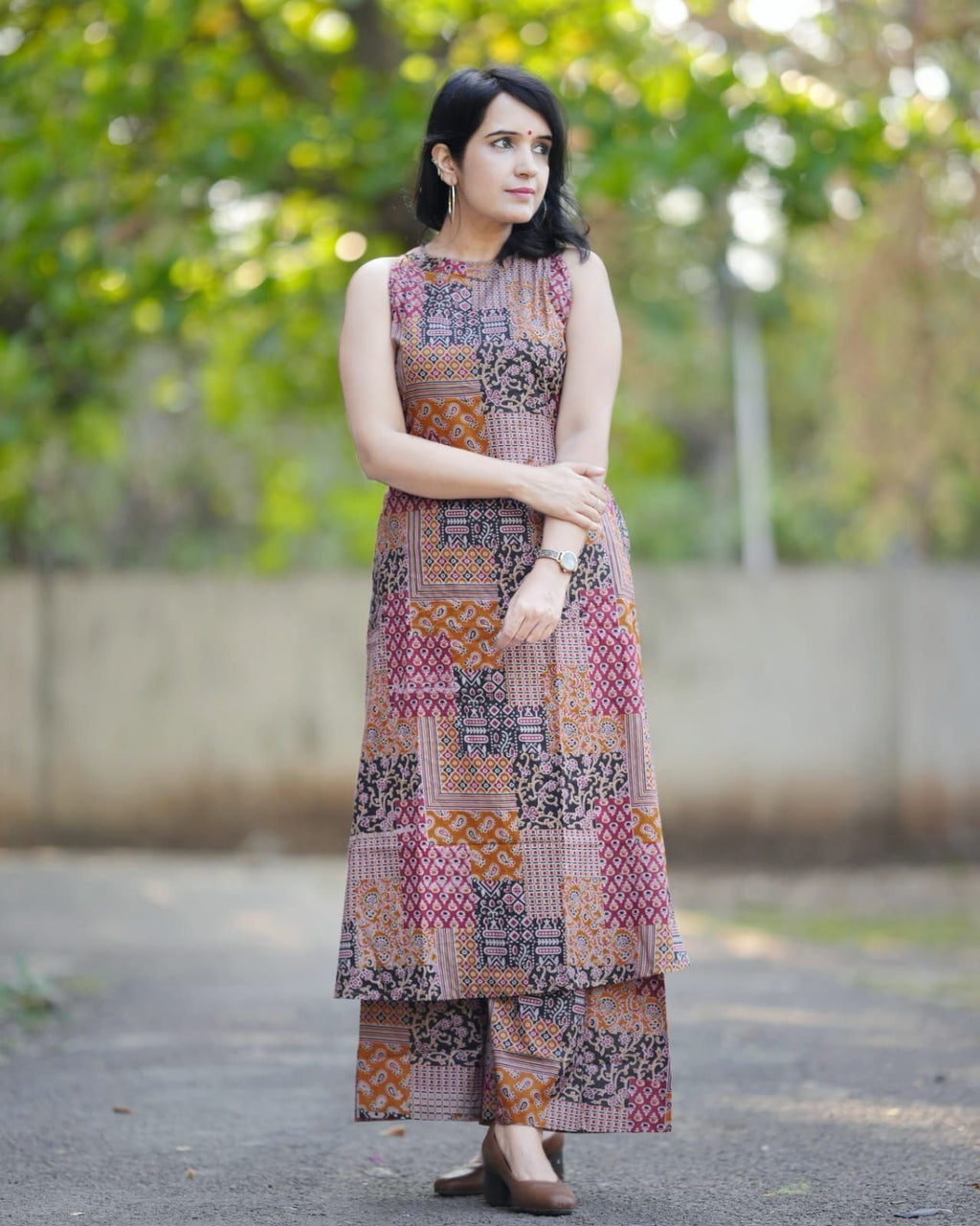 Dhimhi women's geometric printed round neck A-line kurta with matching palazzos, stylish and comfortable ethnic wear ensemble.