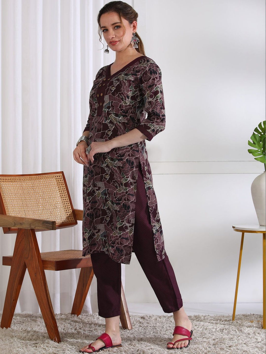 Dhimhi women's ethnic printed kurta with motifs paired with matching trousers, traditional Indian style, full-length outfit.