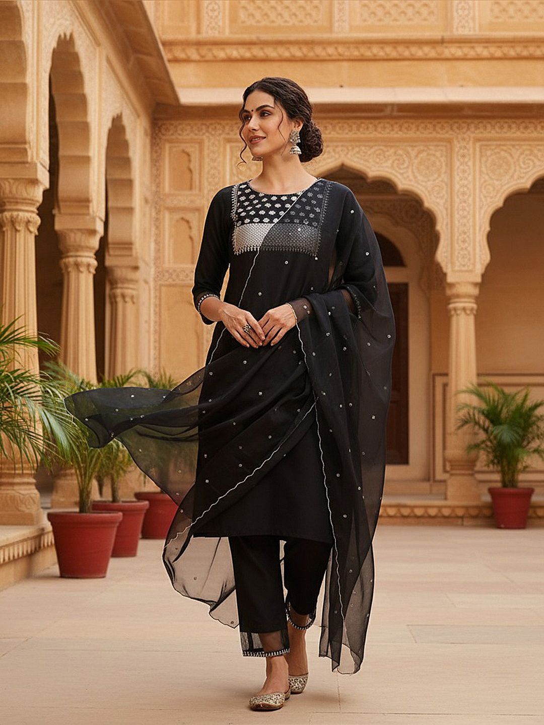 Dhimhi women's ethnic motifs kurta set featuring a sequinned yoke design, paired with matching trousers and dupatta.